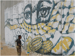 Photo3-To Exist is to Resist - Mural in progress-Palestine 2004- Courtesy of Chávez Pavón  .JPG